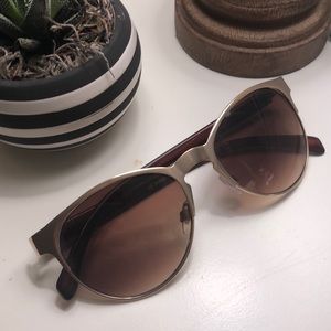 Gold rimmed sunglasses